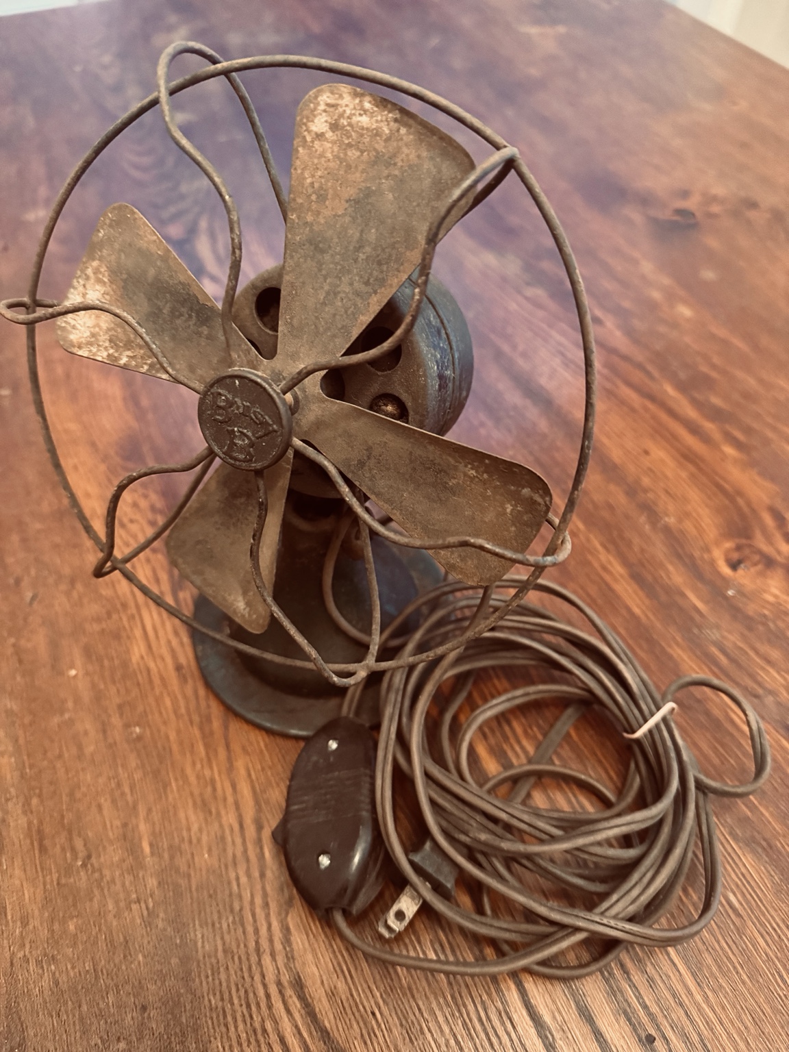Antique fan waiting for workshop inspection